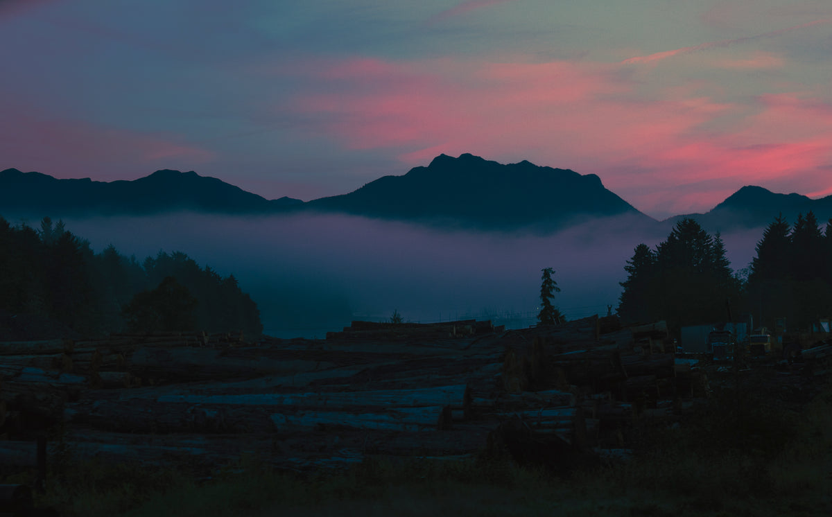 Rose-colored light over distant mountains